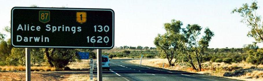 Road sign showing distance to next town